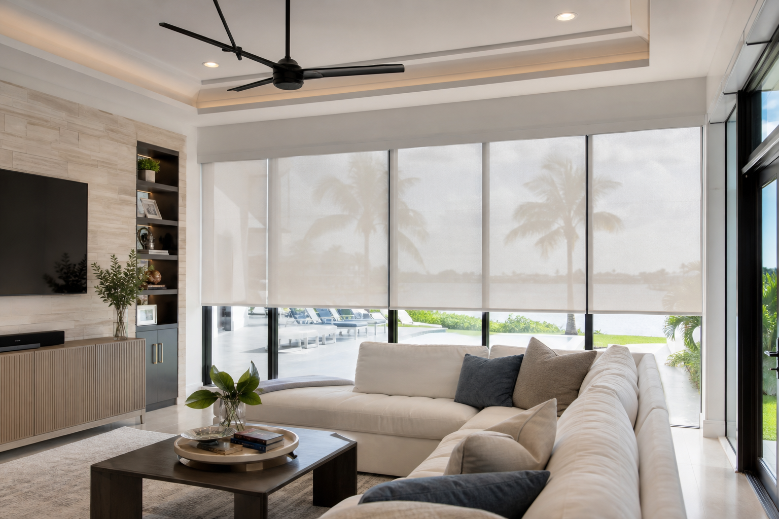 Modern South Florida living room with custom motorized shades covering large windows