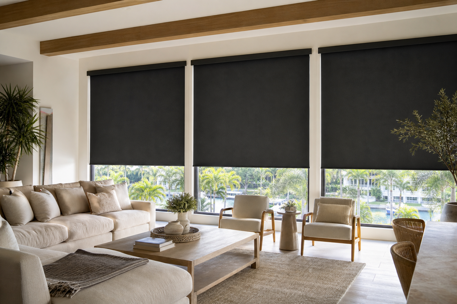 Blackout shades covering large windows in a bright South Miami home living room